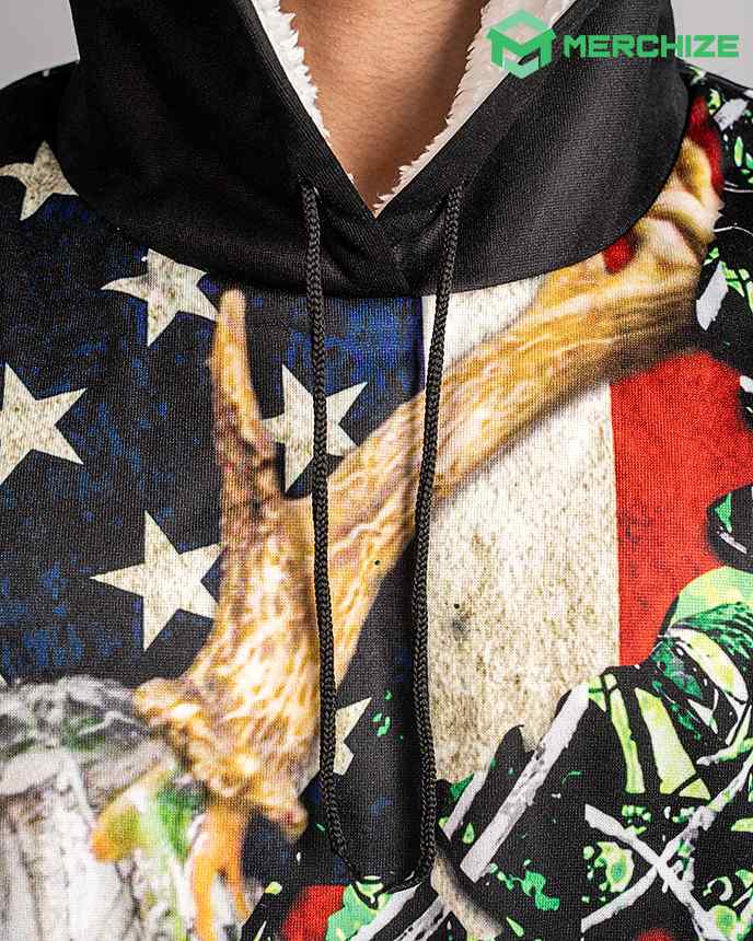 A close-up of a red, white, and blue hoodie with an American flag design on the front. The hoodie also has two deer antlers sticking out of the hood.
